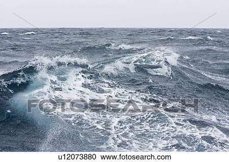 Stock Image - The Drake Passage from aboard the National Geographic Endeavour. The Drake passage crosses the roaring forties and furious fifties (degrees of lattitude). This is the passage between Cape Horn, South America to the Antarctic Peninsula. It can be one of th. Fotosearch