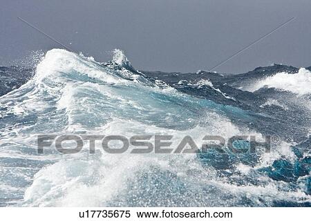 Stock Photography - The Drake Passage from aboard the National Geographic Endeavour. The Drake passage crosses the roaring forties and furious fifties (degrees of lattitude). This is the passage between Cape Horn, South America to the Antarctic Peninsula. It can be one of th. Fotosearch
