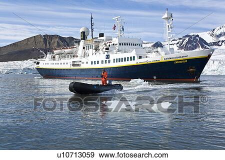 The expedition travel ship National Geographic Endeavour and Zodiac working near Spitsbergen in the Barents Sea, Norway. View Large Photo Image Stock Photo - The expedition travel ship National Geographic Endeavour and Zodiac working near Spitsbergen in the Barents Sea, Norway.. Fotosearch