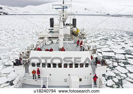 Picture - The Lindblad expedition ship National Geographic Endeavour operating in shre fast ice in Port Foster within the caldera at Deception Island, South Shetland Island Group, Antarctica.. Fotosearch