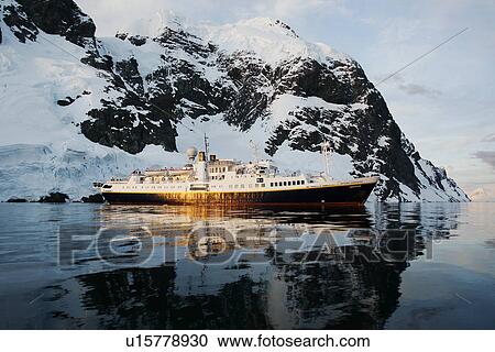 The National Geographic Endeavour at sunset in the Lemaire Channel near the Antarctic Peninsula. View Large Photo Image Stock Image - The National Geographic Endeavour at sunset in the Lemaire Channel near the Antarctic Peninsula.. Fotosearch