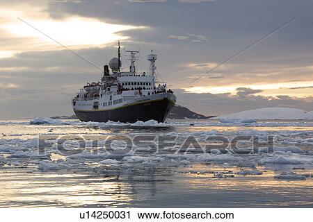 The National Geographic Endeavour pushing through brash ice and small icebergs in the Lemaire Channel near the Antarctic Peninsula. View Large Photo Image Stock Image - The National Geographic Endeavour pushing through brash ice and small icebergs in the Lemaire Channel near the Antarctic Peninsula.. Fotosearch