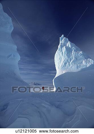 Stock Photography - Walking through an iceberg, Baffin Island, Canadian High Arctic. Fotosearch