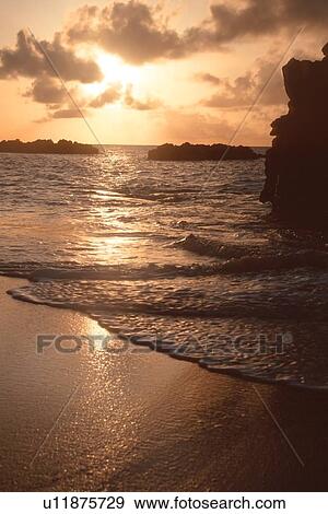 Waves and sunset at Waimea bay, North Shore, Oahu, Hawaii, (N. Pacific) View Large Photo Image Stock Photo - Waves and sunset at Waimea bay, North Shore, Oahu, Hawaii, (N. Pacific). Fotosearch