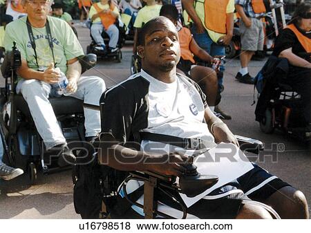 African-American man with a disability participating in the ADAPT March on Washington to advocate for the civil rights of people with disabilities. View Large Photo Image Stock Photo - African-American man with a disability participating in the ADAPT March on Washington to advocate for the civil rights of people with disabilities.. Fotosearch
