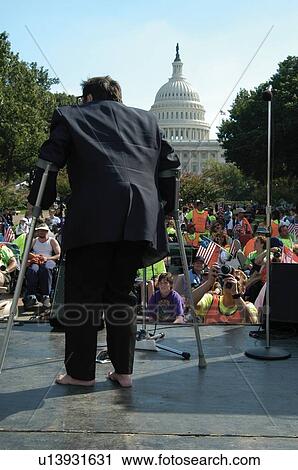 Angry, militant person with a disability speaking to a crowd at the ADAPT March on Washington to advocate for the civil rights of people with disabilities. View Large Photo Image Stock Image - Angry, militant person with a disability speaking to a crowd at the ADAPT March on Washington to advocate for the civil rights of people with disabilities.. Fotosearch