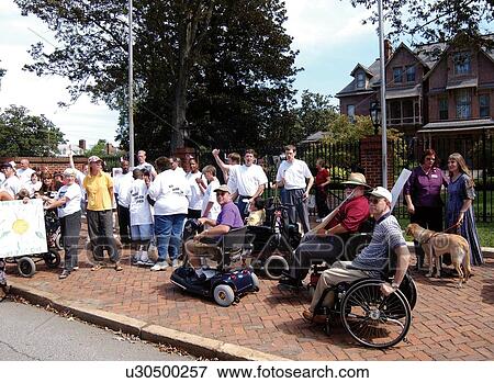 Crowd of people with and without disabilities demonstrating and shouting in front of the Governor's Mansion. Group was forced to leave the premises as there was confusion regarding demonstration permits. Truly, advocacy in action. View Large Photo Image Stock Photo - Crowd of people with and without disabilities demonstrating and shouting in front of the Governor's Mansion. Group was forced to leave the premises as there was confusion regarding demonstration permits. Truly, advocacy in action.. Fotosearch