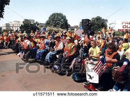 Stock Image - Crowd of people with disabilities preparing to MARCH ON WASHINGTON, D. C. to advocate for the civil rights of people with disabilities.. Fotosearch