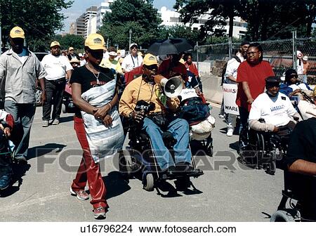 Group of people with disabilities participating in a Freedom March to advocate for the civil rights of people with disabilities. View Large Photo Image Picture - Group of people with disabilities participating in a Freedom March to advocate for the civil rights of people with disabilities.. Fotosearch
