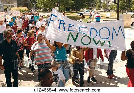 Large crowd of people with and without disabilities participating in a Freedom March to advocate for the civil rights of people with disabilities. View Large Photo Image Picture - Large crowd of people with and without disabilities participating in a Freedom March to advocate for the civil rights of people with disabilities.. Fotosearch