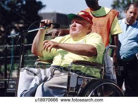 Older Man with a disability speaking to a crowd attending the ADAPT March on Washington to advocate for the civil rights of people with disabilities. View Large Photo Image Stock Photograph - Older Man with a disability speaking to a crowd attending the ADAPT March on Washington to advocate for the civil rights of people with disabilities.. Fotosearch