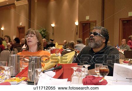 Stock Photography - People with disabilities attending and listening at a conference for Disability Activists.. Fotosearch