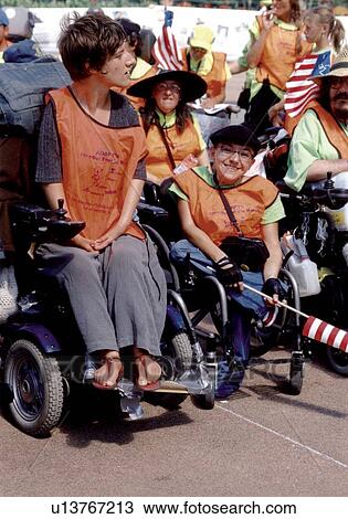 Three women with various disabilities, utilizing wheelchairs for mobility, participating in an event to advocate for the civil rights of people with disabilities. View Large Photo Image Stock Image - Three women with various disabilities, utilizing wheelchairs for mobility, participating in an event to advocate for the civil rights of people with disabilities.. Fotosearch