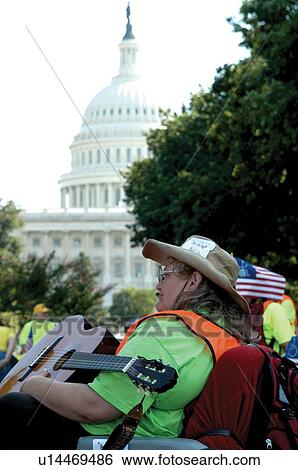 Stock Photograph - Woman in wheelchair participating in ADAPT March on Washington to advocate for civil rights for people with disabilities.. Fotosearch