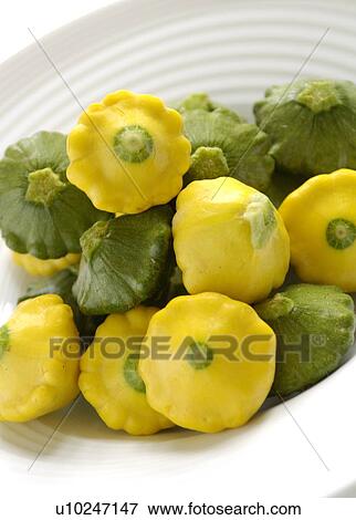 A bowl of baby green & yellow pan squash View Large Photo Image Stock Photo - A bowl of baby green & yellow pan squash. Fotosearch