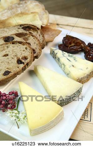 Stock Image - Cheese with dates and chutney. Fotosearch