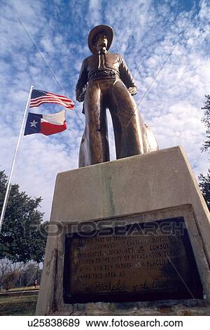 Stock Photo - bronze statue in front of two flags. Fotosearch