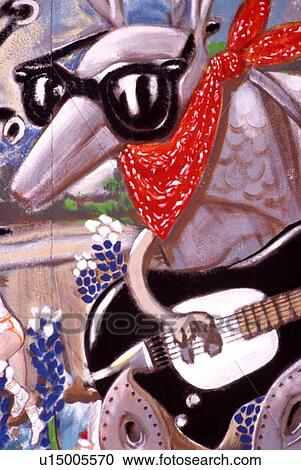 Stock Image - close up of an armadillo in a painting on the street. Fotosearch