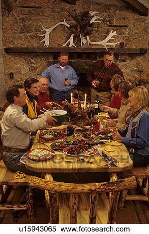 Friends and family gathered around the table for a dinner party. View Large Photo Image Stock Photography - Friends and family gathered around the table for a dinner party.. Fotosearch