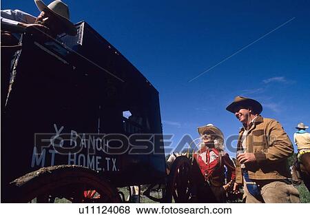 group standing around an old western wagon View Large Photo Image Stock Photo - group standing around an old western wagon. Fotosearch