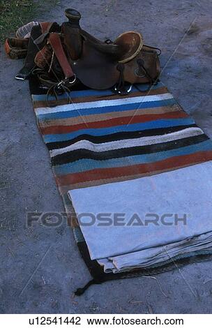 Stock Image - horse saddle and blankets. Fotosearch