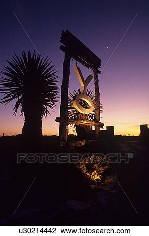 Stock Image - lighted ranch sign at sunset. Fotosearch