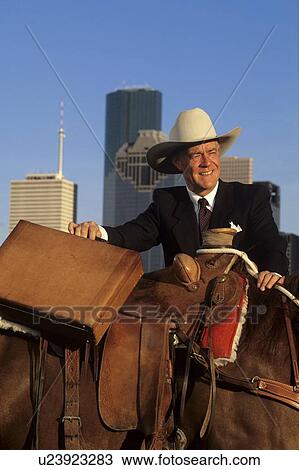 man with briefcase standing by a horse in front of the Houston skyline View Large Photo Image Stock Image - man with briefcase standing by a horse in front of the Houston skyline. Fotosearch