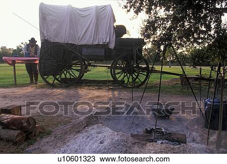 old western wagon and extinguished fire at a campsite View Large Photo Image Stock Image - old western wagon and extinguished fire at a campsite. Fotosearch