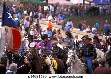 Stock Image - people riding to the rodeo in Houston. Fotosearch
