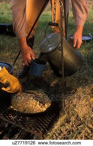 Stock Photograph - serving fresh hot food and drinks from the campfire. Fotosearch