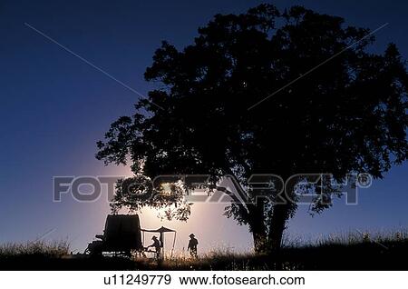 Silhouette of a wagon in front of a Texas sky View Large Photo Image Stock Photo - Silhouette of a wagon in front of a Texas sky. Fotosearch