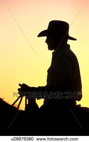 silhouette profile of a cowboy riding a horse View Large Photo Image Stock Image - silhouette profile of a cowboy riding a horse. Fotosearch