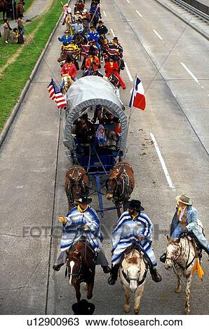 trail riders and wagon going through Houston View Large Photo Image Stock Image - trail riders and wagon going through Houston. Fotosearch