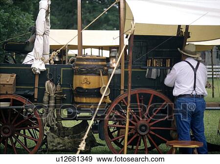 Stock Photo - Unloading the wagon. Fotosearch