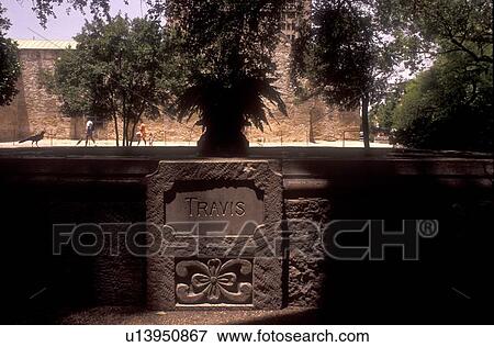 Stock Photo - wall engraved with Travis in San Antonio Texas. Fotosearch