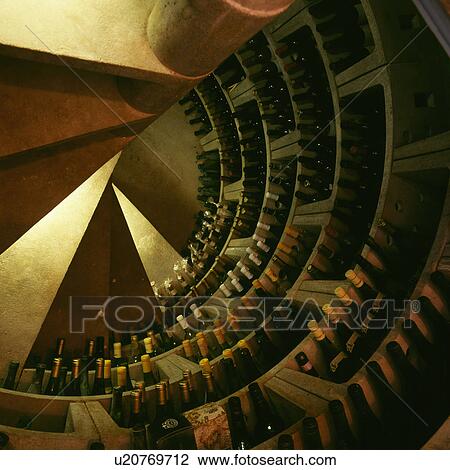 Aerial view of circular staircase with wine stored on circular shelves View Large Photo Image Stock Image - Aerial view of circular staircase with wine stored on circular shelves. Fotosearch