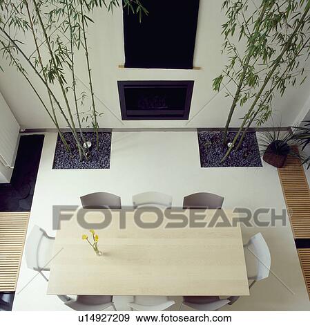 Aerial View Of Maple Topped Dining Table On Concrete Floor With
