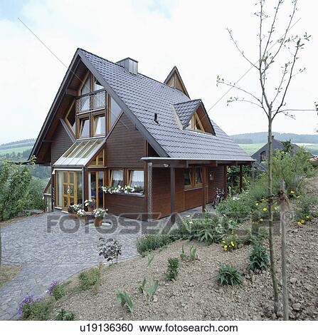 Stock Image - Alpine influenced modern detached house in Germany.. Fotosearch