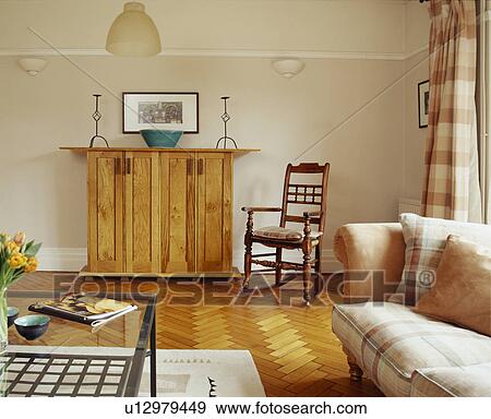 Antique chair and pine cupboard in traditional living room with parquet floor View Large Photo Image Stock Photo - Antique chair and pine cupboard in traditional living room with parquet floor. Fotosearch