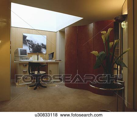 Antique swivel chair at desk in modern home office with skylight View Large Photo Image Stock Photo - Antique swivel chair at desk in modern home office with skylight. Fotosearch