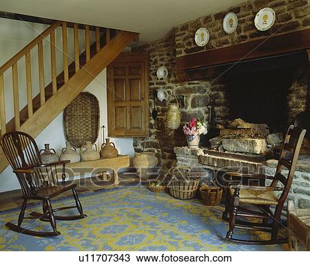 Stock Photo of Antique Windsor rocking chairs beside inglenook ...