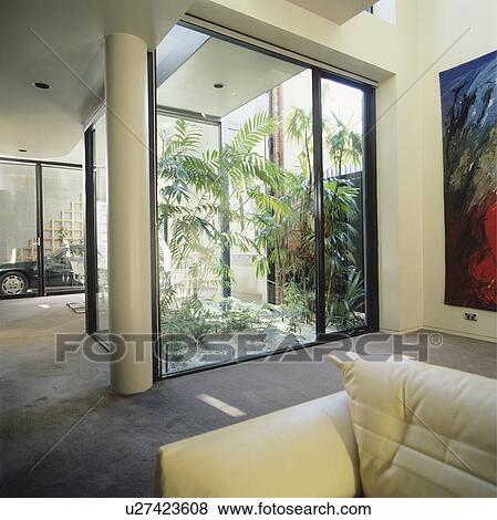 Stock Photo - Atrium in modern white living room. Fotosearch