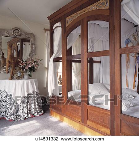 Bed with white linen in hand-built frame in country bedroom View Large Photo Image Stock Image - Bed with white linen in hand-built frame in country bedroom. Fotosearch