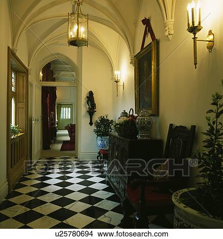 Picture - Black and white flooring in country hall with glass lanterns and vaulted ceiling. Fotosearch