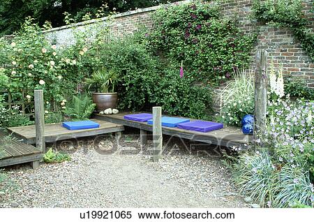 Blue cushions on wooden benches in country garden in summer View Large Photo Image Stock Photography - Blue cushions on wooden benches in country garden in summer. Fotosearch
