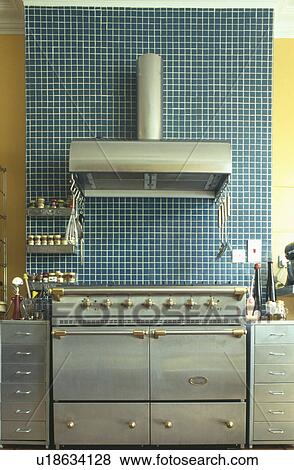 Blue mosaic tiles above stainless steel modern range oven View Large Photo Image Stock Photo - Blue mosaic tiles above stainless steel modern range oven. Fotosearch