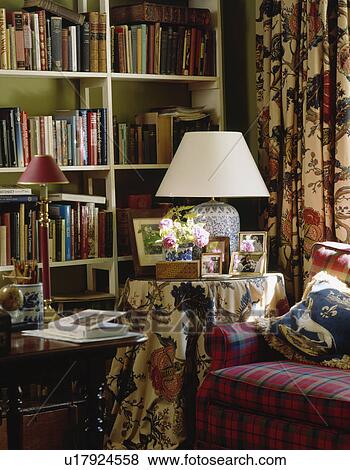 Bookshelves and lamp on table in traditional living room View Large Photo Image Stock Photo - Bookshelves and lamp on table in traditional living room. Fotosearch
