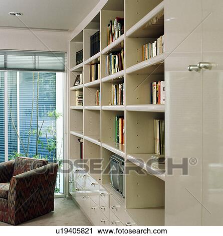 Stock Image - Bookshelves in modern white living room. Fotosearch