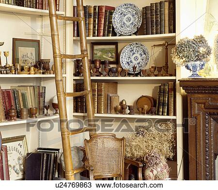 Stock Image - Bookshelves in traditional living room. Fotosearch