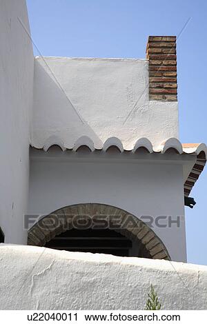 Brick chimney on traditional white Spanish house View Large Photo Image Stock Image - Brick chimney on traditional white Spanish house. Fotosearch